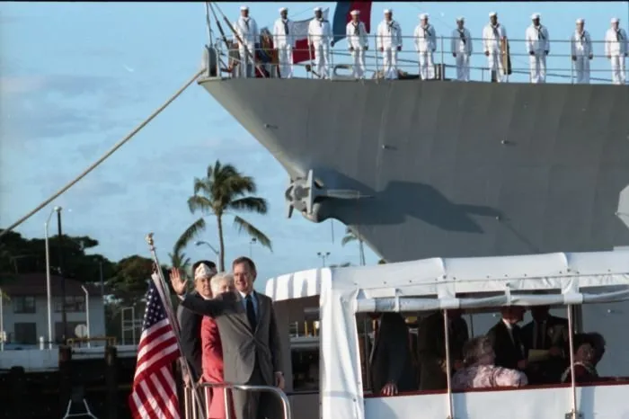 President and Mrs. Bush leave the USS Arizona Memorial aboard the Admiral's Barge after attending a ceremony commemorating the 50th anniversary of the Japanese attack on Pearl Harbor.