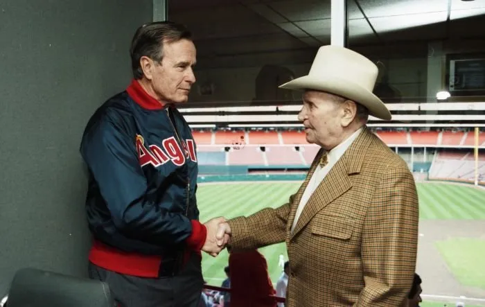 President Bush greets Gene Autry before a baseball game between the Baltimore Orioles and the California Angels in Los Angeles