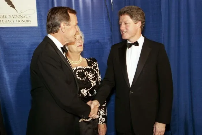 President Elect and Mrs. Bush greet Arkansas Governor Bill Clinton at a Literacy dinner sponsored by ABC, PBS, and Prudential and hosted by Peter Jennings to honor seventeen "Learners of the Month."