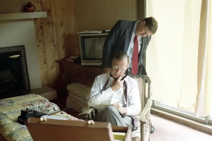 President Bush speaks to King Fahd of Saudi Arabia via telephone from his suite at the Catto Ranch in Aspen, Colorado regarding Iraq's Invasion of Kuwait