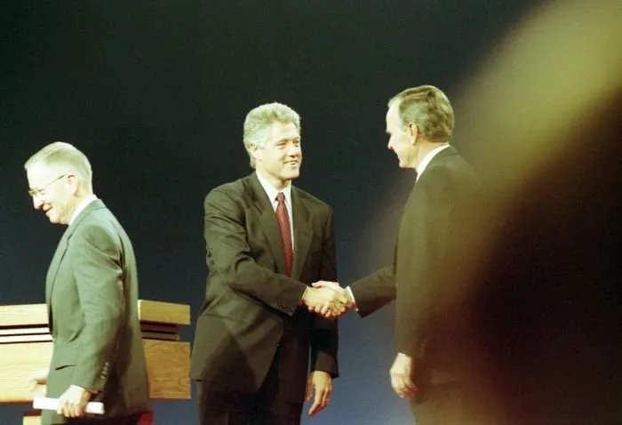 President Bush participates in the third and final Presidential Debate between himself, Governor Bill Clinton, and Ross Perot in East Lansing, Michigan