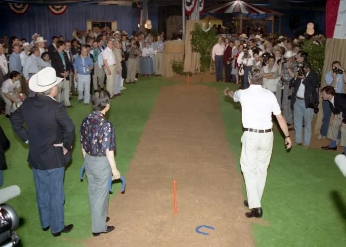 President Bush pitches horseshoes with participants of Economic Summit