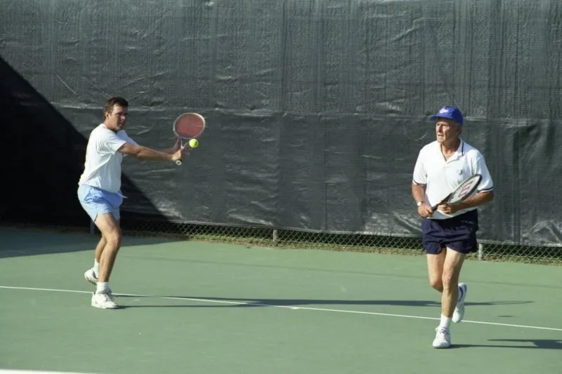 President Bush plays tennis at Walker's Point with Jeb