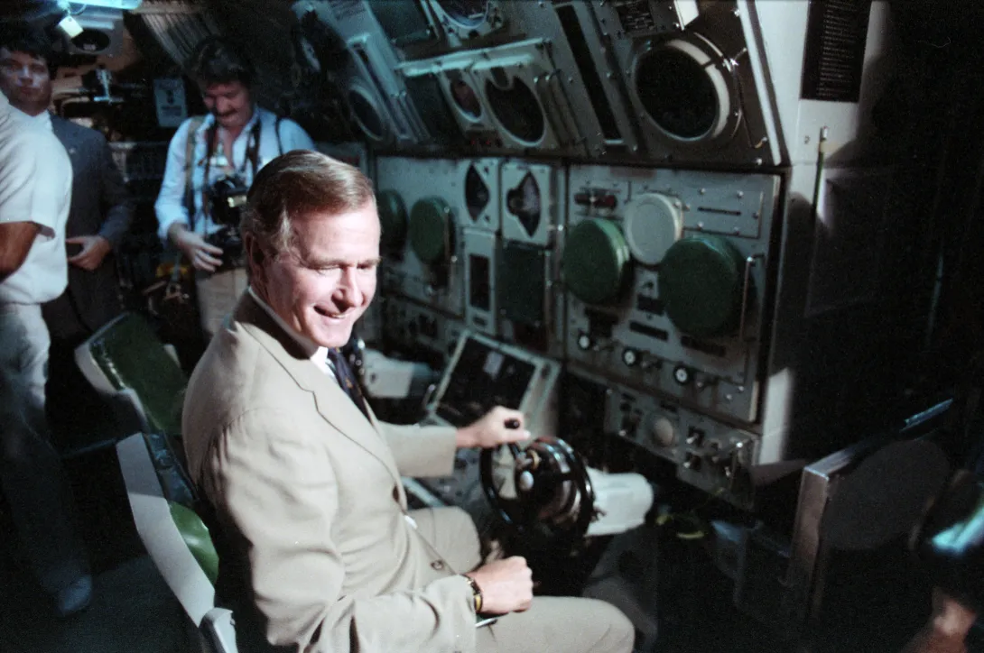 Vice President and Mrs. Bush board the submarine USS Finback (SSN-670), during ceremony at Naval Station Norfolk, Virgina commemorating the 40th anniversary of the day he was shot down over Chi Chi Jima.  The submarine is the namesake of the USS FInbac...
