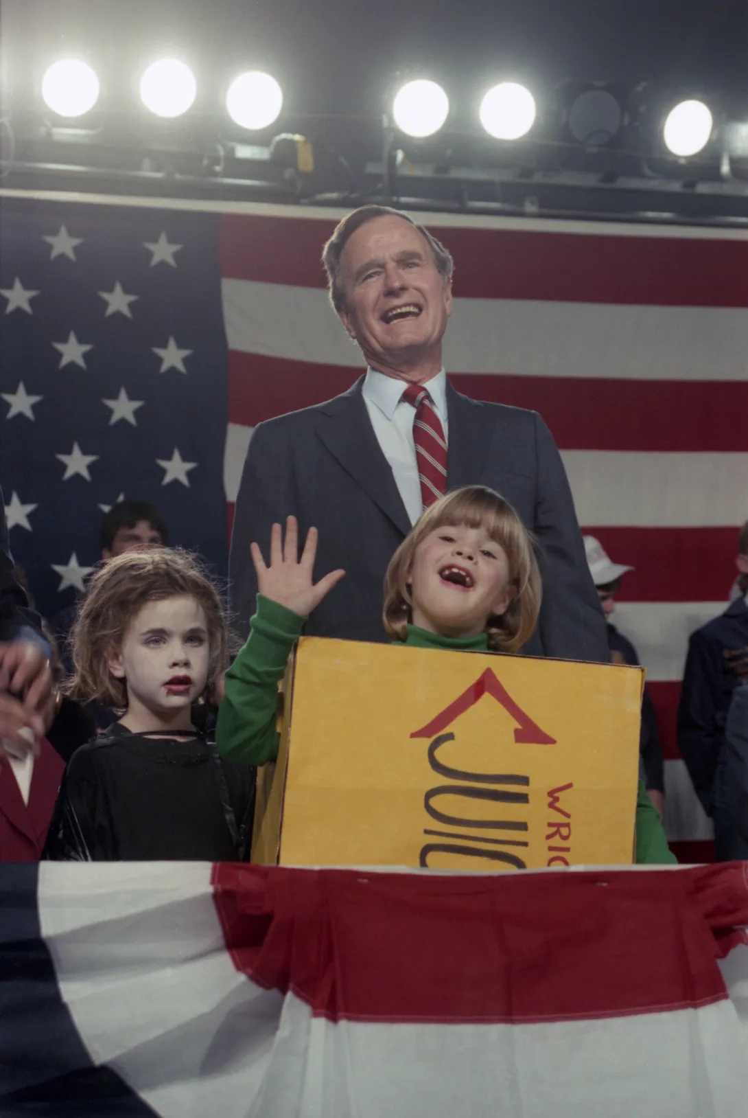 Vice President Bush's granddaughters, Barbara and Jenna, who are dressed in Halloween costumes, appear on stage with him at a campaign event in Kansas City, Missouri