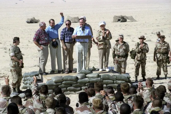 President and Mrs. Bush visit troops from the U.S. Army’s 197th Brigade in Saudi Arabia, and have Thanksgiving Dinner with them
