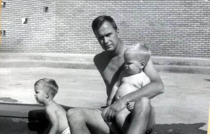 George swims with his sons, Jeb and Neil (on lap)