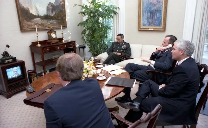 President Bush watches Iraqi Foreign Minister Tariq Aziz on television