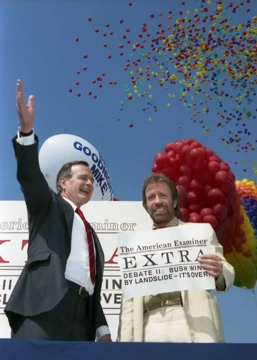 Vice President Bush and Chuck Norris share a laugh at The American Examiner headline that reads: EXTRA, Debate III Bush Wins by Landslide, It's Over,'
