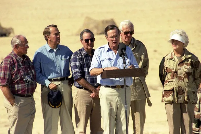President and Mrs. Bush visit troops from the U.S. Army’s 197th Brigade in Saudi Arabia, and have Thanksgiving Dinner with them