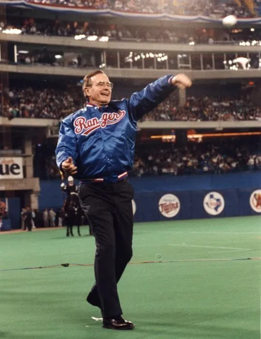 President Bush throws out the first pitch at the 1990 season opener between the Texas Rangers and the Toronto Blue Jays