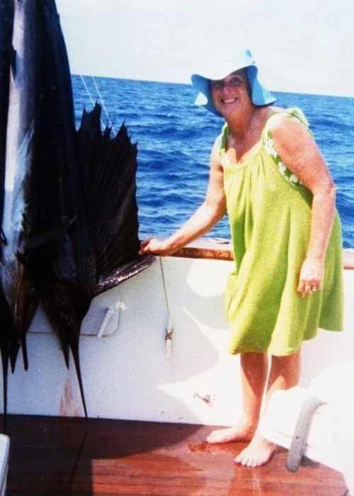 Barbara Bush Extends the Dorsal Fin of a Sail Fish they Caught Off the Coast of Cancun, Mexico