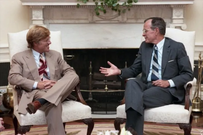President Bush visits with Robert Redford in the Oval Office
