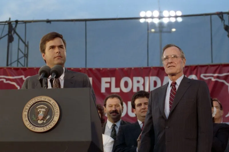 President Bush addresses a Bush-Quayle fundraising dinner and is introduced by Jeb
