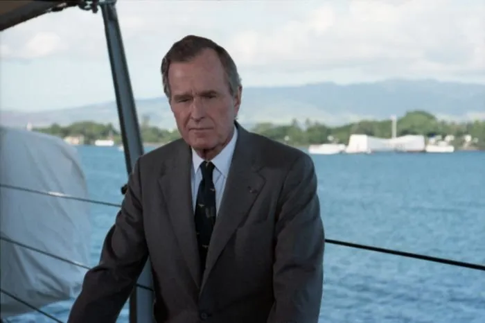President Bush participates in a television taping session aboard the USS Missouri on the 50th anniversary of the Japanese attack on Pearl Harbor.