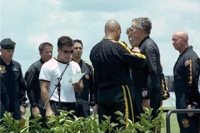 George Bush receives his jump wings from members of the Golden Knights following his 80th birthday jump