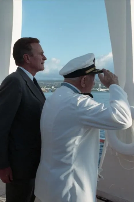 President Bush stands at attention as USS Nevada survivor and Medal of Honor recipient, Captain Donald K. Ross (USN Retired)