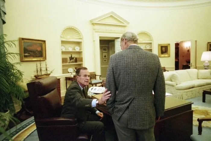 President Bush meets with James Baker in the Oval Office before debate rehearsal