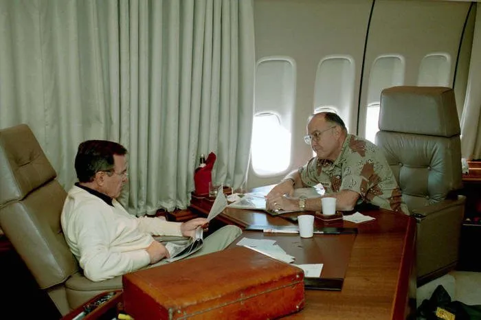 President Bush meets with General Norman Schwarzkopf aboard Air Force One