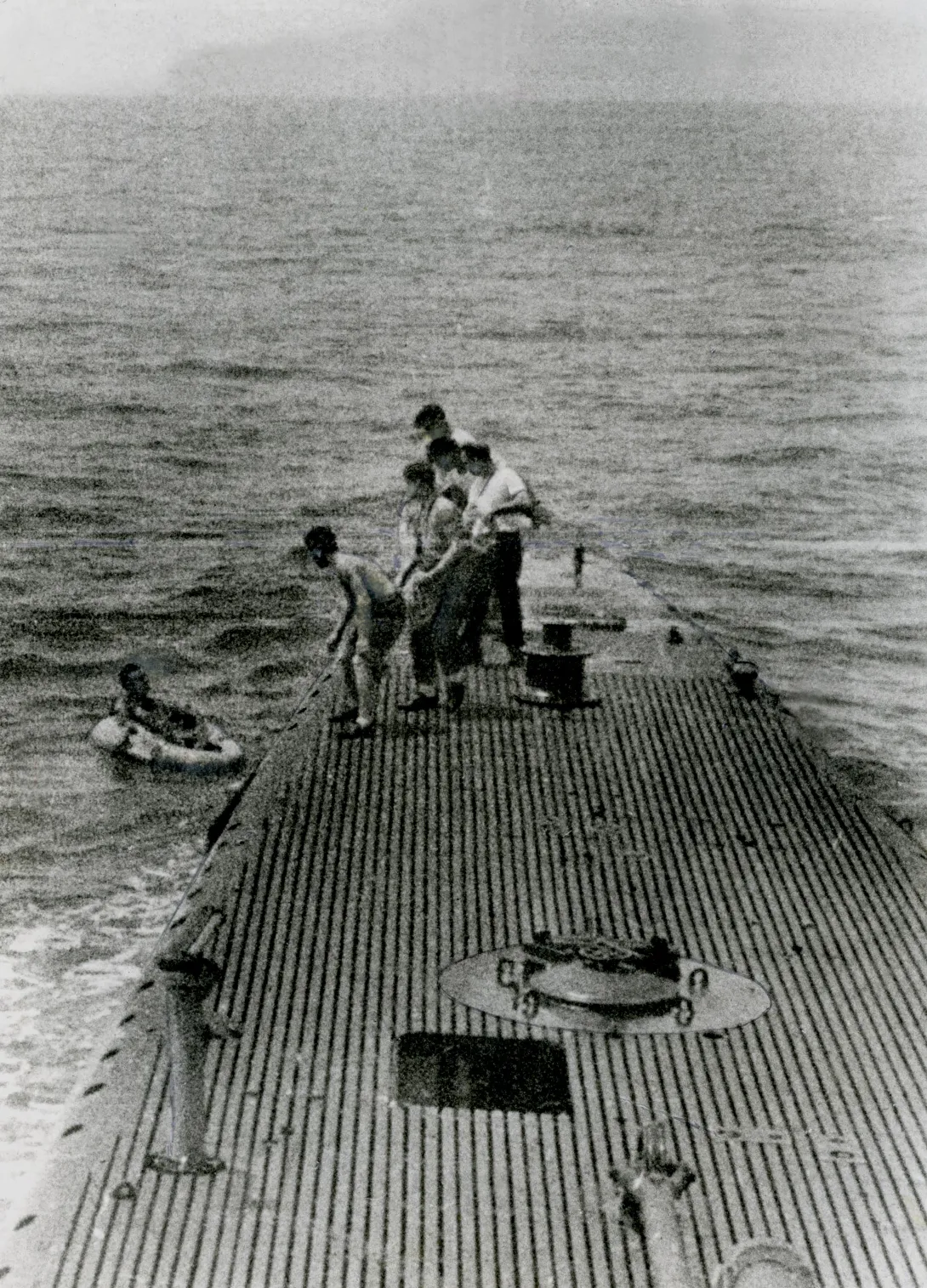 George Bush being rescued by the submarine, the U.S.S. Finback, after being shot down while on a bombing run of the Island of Chi Chi Jima