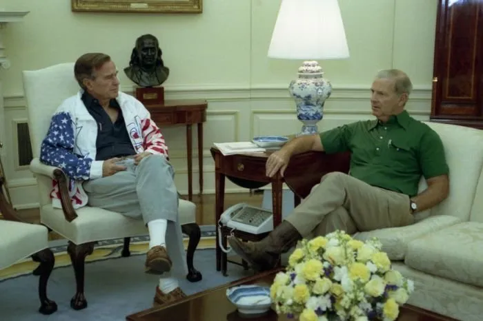 President Bush participates in a Debte Briefing with James Baker in the Oval Office