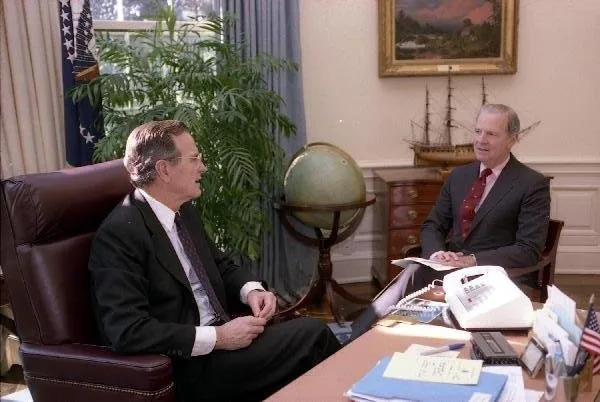 President Bush meets with Baker in the Oval Office