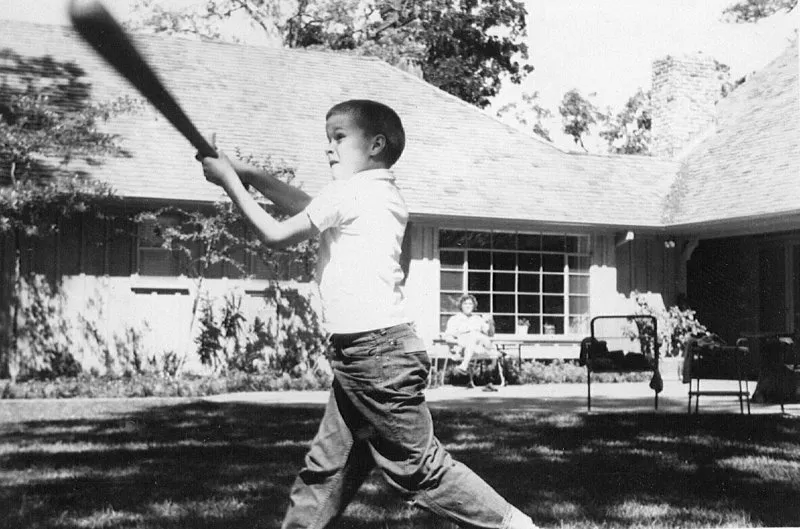 Jeb Bush swinging a baseball bat