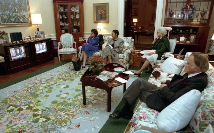 Doro LeBlond, Anna Perez, Mrs. Bush, and Rev. Billy Graham watch President Bush’s speech to the nation regarding the commencement of Operation Desert Storm, from the White House Residence