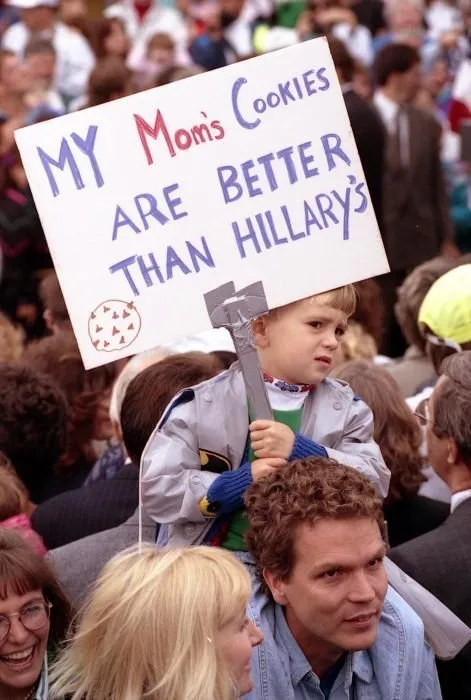 A young supporter holds a sign in the crowd in Wixom, MI