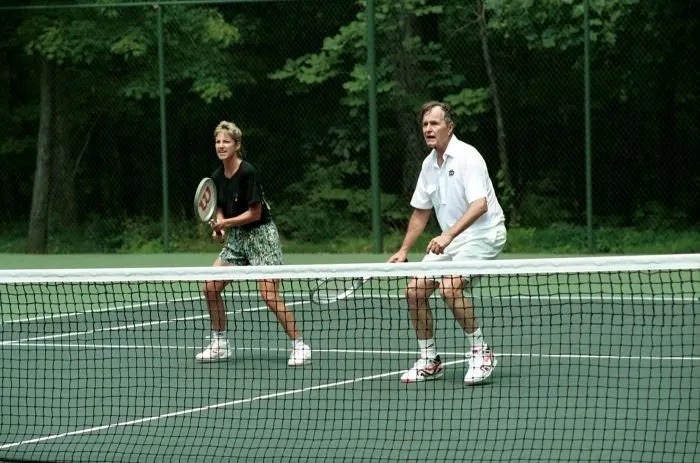 President Bush plays doubles tennis with Chris Evert, David Bates, and Tut Bartzen