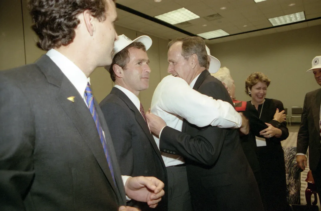 Vice President Bush hugs Jeb bush and celebrates electon results with friends