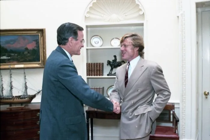 President Bush visits with Robert Redford in the Oval Office