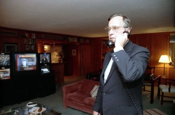 President Bush talks on the telephone while watching election results