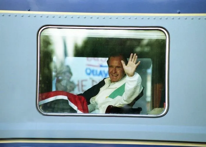 President Bush waves to the crowd as his traincar leaves Burlington, NC