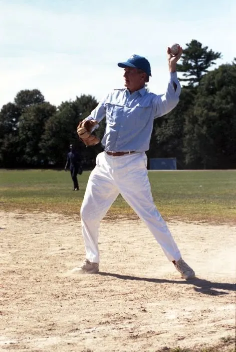 President Bush participates in a softball game with the press and staff in Kennebunkport, Maine