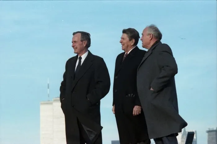 President-Elect Bush, President Reagan, and President Gorbachev at the Governor's Island Summit in New York. The World Trade Center is visible in the background