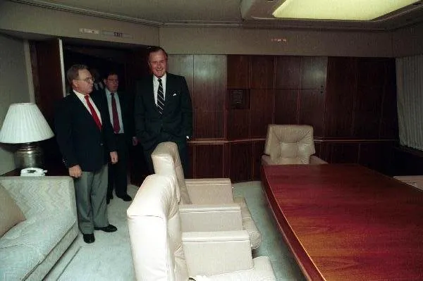 President Bush tours the new Air Force One while on the inaugural flight