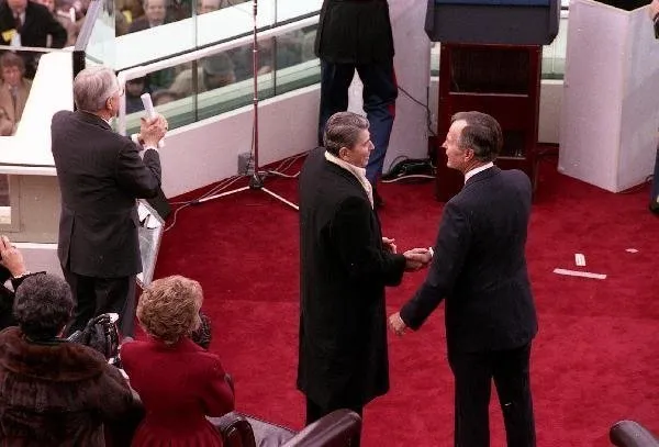President Bush shakes hands with former President Reagan