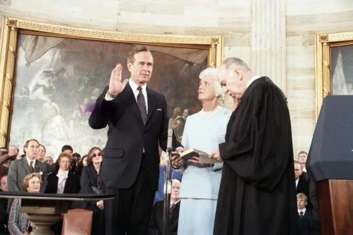 Supreme Court Justice Potter Stewart administers the Vice Presidential Oath of Office to Vice President George Bush as Mrs. Bush holds the Bible at the US Capitol