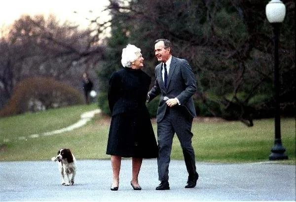 President and Mrs. Bush walk with Millie
