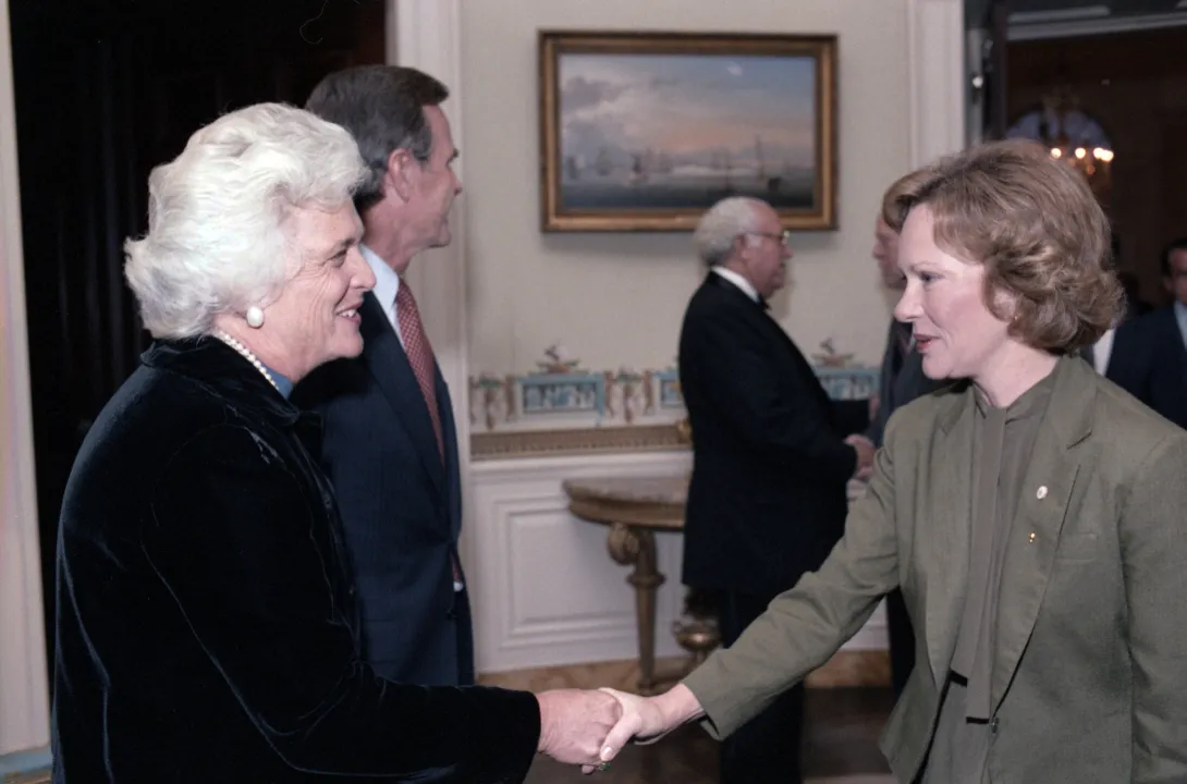 Second Lady Barbara Bush greets former First Lady Rosalyn Carter during an event in which former Presidents Carter, Ford, and Nixon and their spouses met with the Reagans and Bushes before departing to Egypt to attend the funeral of slain Egypt Preside...