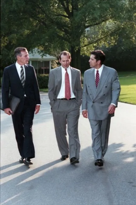 President Bush walks on the South Lawn Driveway with actor Bruce Willis