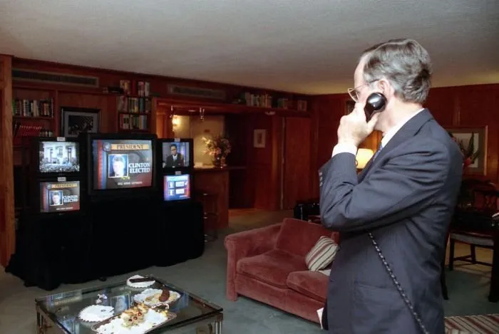 President Bush talks on the telephone while watching election results