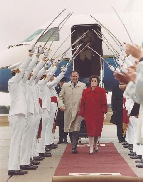 President Bush and Doro are greeted with saber arch by Texas A&M Corps of Cadets
