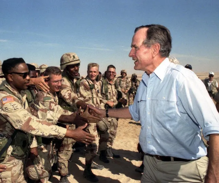 President Bush visits with troops during the Gulf War