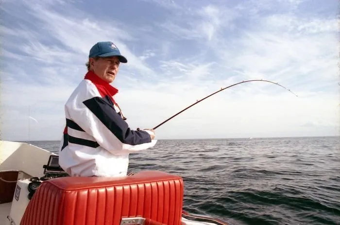 President Bush fishes from Fidelity off the coast of Kennebunkport, Maine