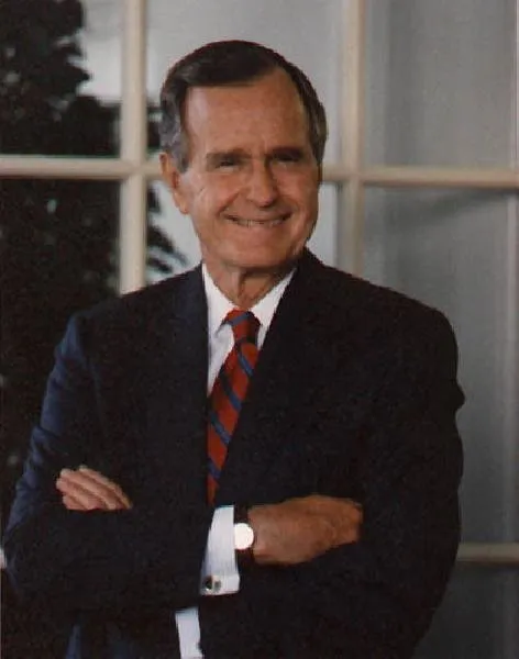President Bush stands in doorway of Oval Office