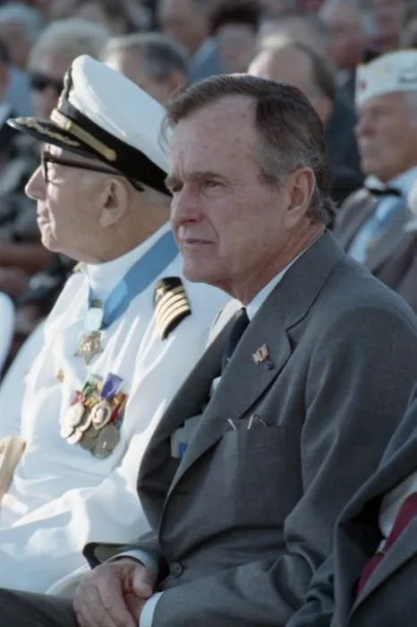 President Bush seated next to Pearl Harbor Survivor and Medal of Honor recipient, Captain Donald Ross (USN Retired)