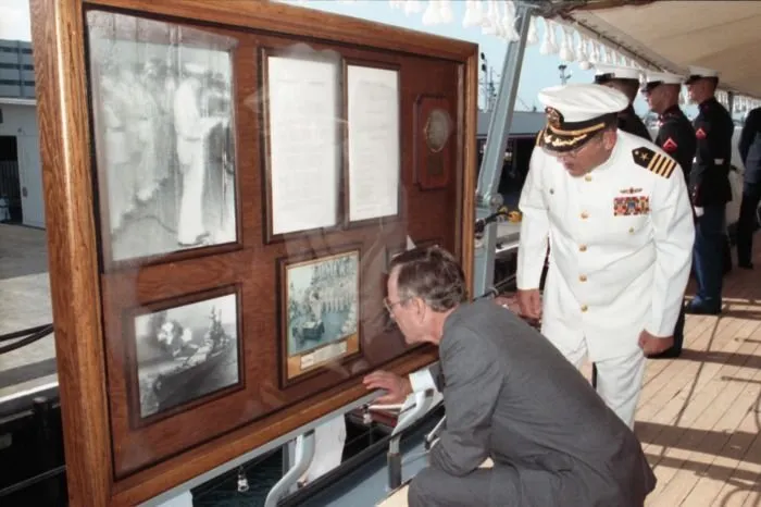 President Bush and Mrs. Bush receive a tour of the USS Missouri from Captain Albert Lee Kaiss on the 50th anniversary of the Japanese attack on Pearl Harbor.