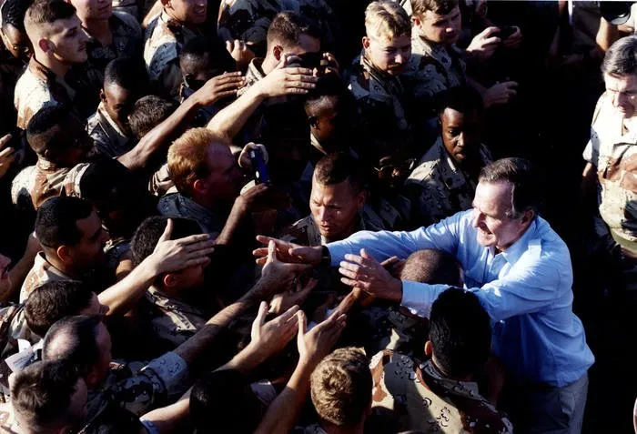President Bush greets troops during his Thanksgiving visit to Saudi Arabia